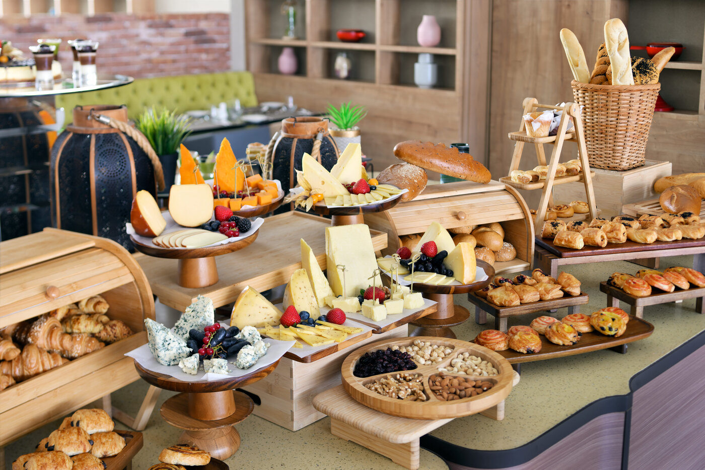 H-Gourmet breakfast and cheese buffet with artisan breads, pastries, and fresh accompaniments